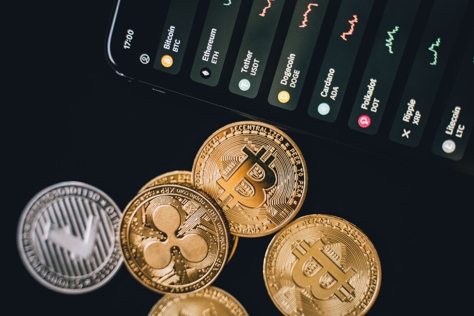 Crypto coins beside a smartphone